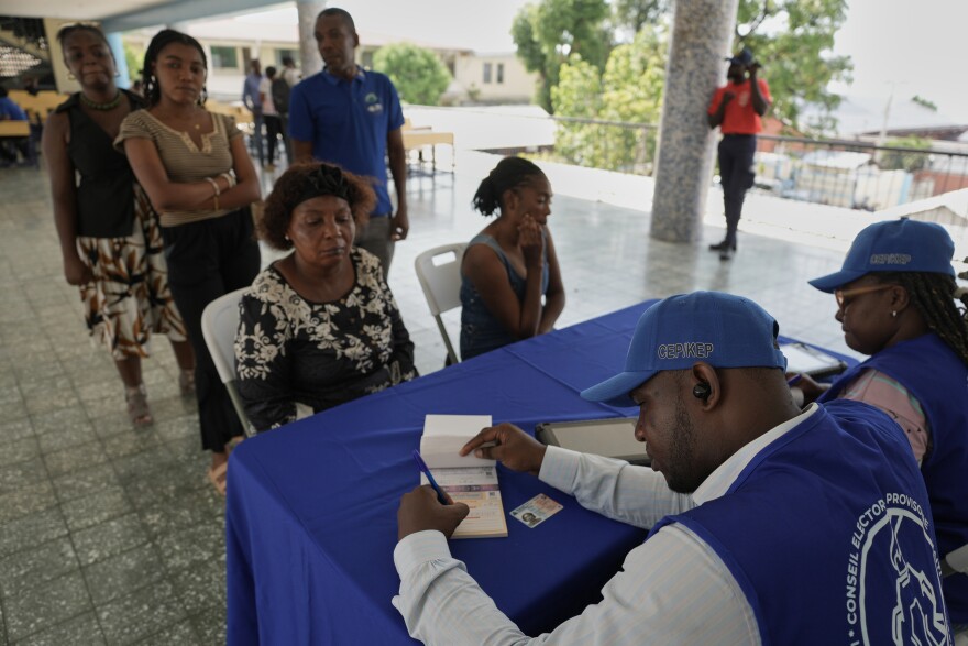Haitians register to vote in the upcoming general election in Port-au-Prince, Haiti, Thursday, July 30, 2026.