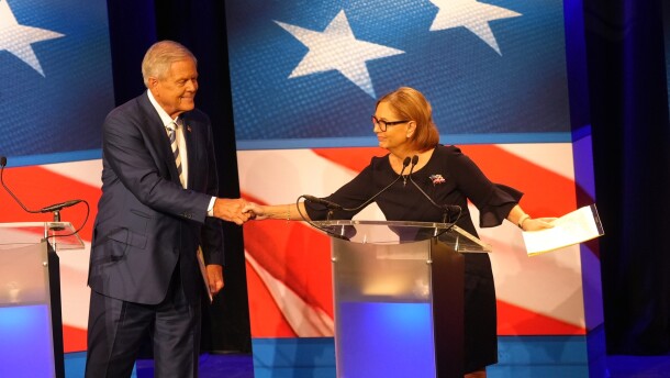 U.S. Rep. Ralph Norman, R-S.C., left, reaches over to shake hands with Sen. Darline Graham, R-S.C., during a debate ahead of the special GOP Senate runoff election to replace the late Sen. Lindsey Graham, R-S.C., in Newberry, S.C., Tuesday, Aug. 18, 2026. (AP Photo/Meg Kinnard)