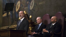 Democratic Gov. Tom Wolf, left, delivers his budget address for the 2019-20 fiscal year to a joint session of the Pennsylvania House and Senate in Harrisburg, Pa., Tuesday, Feb. 5, 2019. House Speaker Mike Turzai, R-Allegheny, is at the center, and Lt. Gov. John Fetterman is at the right. (AP Photo/Matt Rourke)