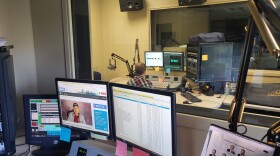 Morning Edition host Nyk Daniels records the latest weather forecast at the KGOU studios.