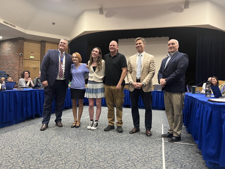 Superintendant Michael Patton, Linda Kranick, and Emily Bush with school officials