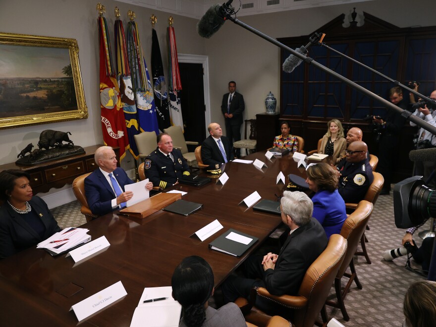 President Biden hosts a meeting that includes White House counsel Dana Remus.