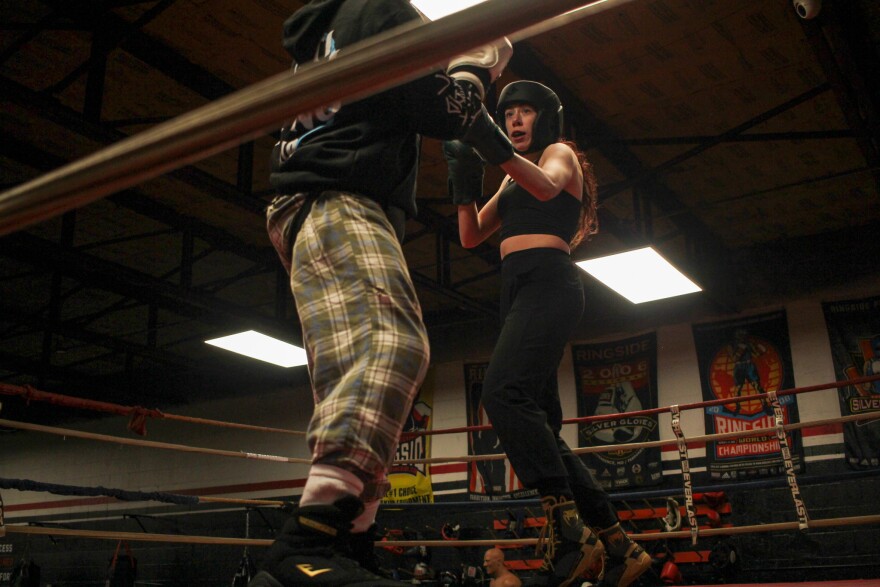 Kate Fulcher, 27, spars against Lynix Lemtz, 13, during an evening practice at the Zanesville PAL boxing gym.