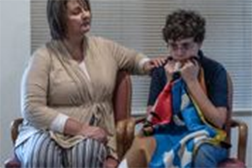 Julie Dixon as Ella, comforts her autistic son Lior, Ron Kalinovsky