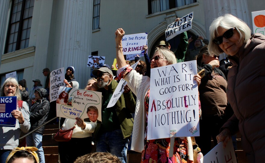 Protestors gathered outside on the steps of Thalian Hall during the No Kings protest.