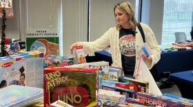 Kasey Bonner looks for toys for a foster child she works with.