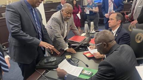 Council for Postsecondary Education President Aaron Thompson, Sen. Gerald Neal, Kentucky State University President Koffi Akakpo and Sen. Chris McDaniel (left to right) discuss Senate Bill 185 after it was passed out of committee in Frankfort.