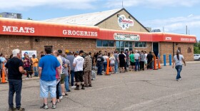 Customers wait in long lines to enter NativeCare on opening day on Aug. 1, 2023.
