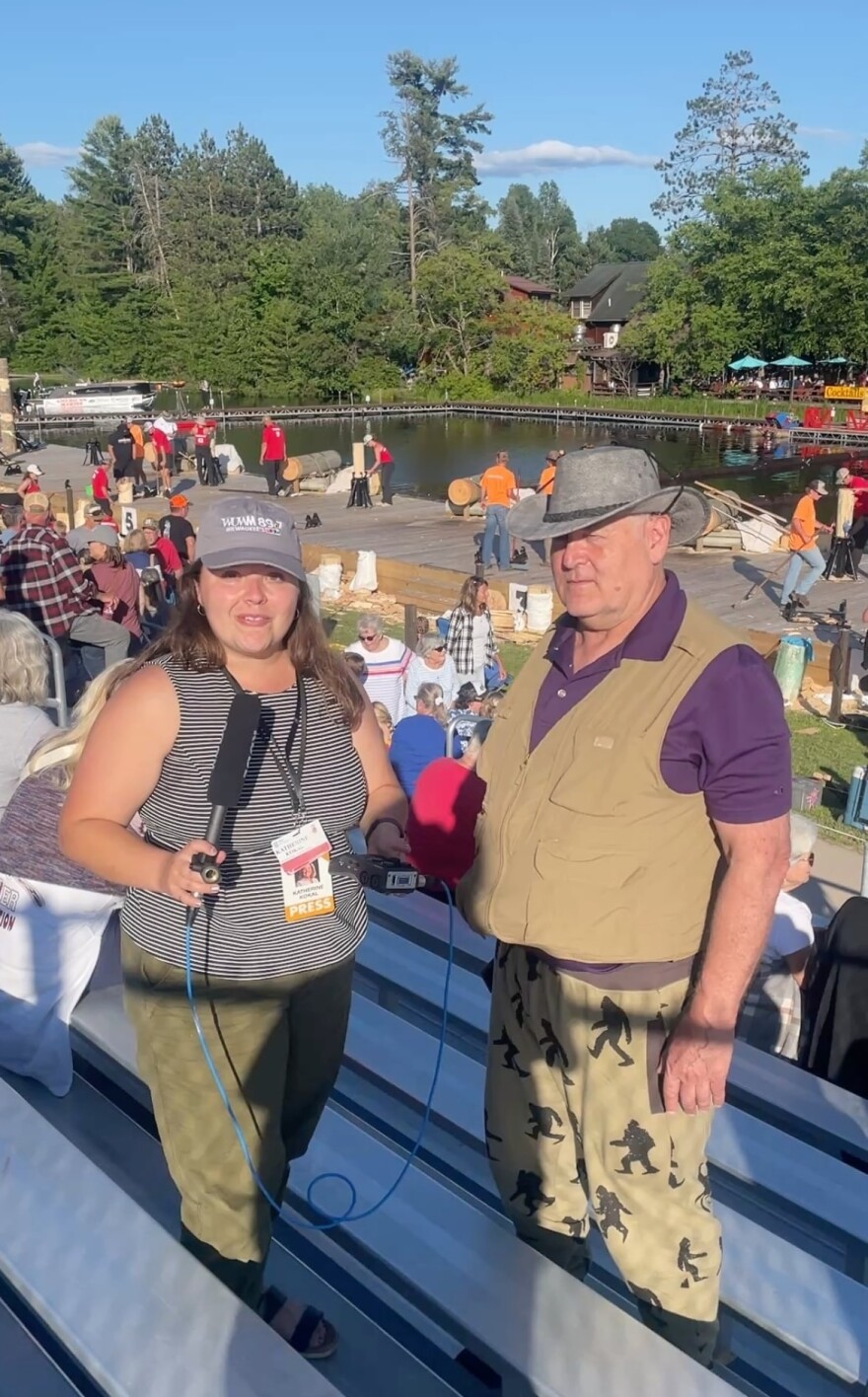 WUWM reporter Katherine Kokal interviews Farris Brown (right) at the 2025 Lumberjack World Championships in Hayward, Wisconsin on July 17, 2025.