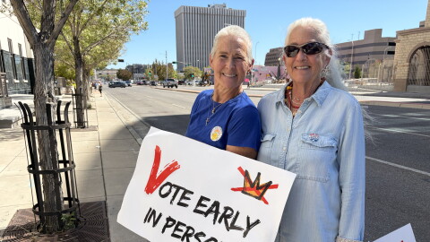 Michelle Schofield (L) and Rosa Weiss (R) holding signs on Lomas Wednesday October 7, 2026 on the first day of early voting for the general election on November 3, 2026.