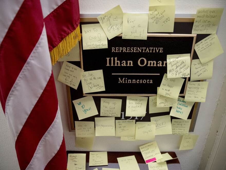 People leave Post-it notes of support outside the office of Rep. Ilhan Omar, D-Minn., on Capitol Hill.