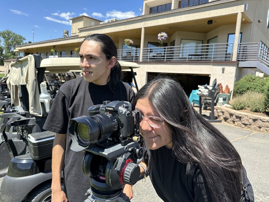 Houston Cunningham and Kristen operate a DSLR camera at a filmmaking workshop in Ignacio, Colorado.