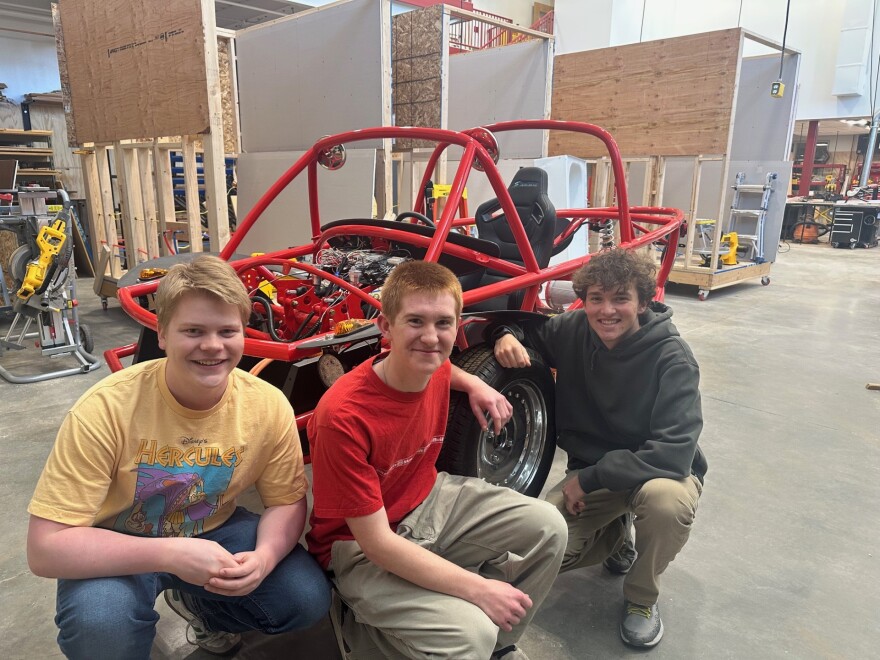 Photo of PCCAPS students who are building a road-worthy electric vehicle.