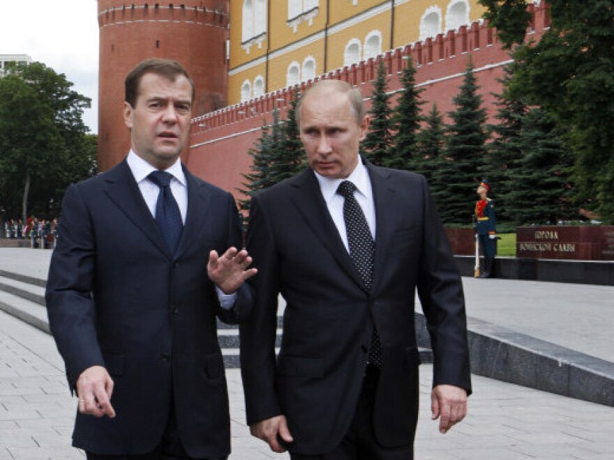 President Dmitry Medvedev (left) and Prime Minister Vladimir Putin walk after a wreath-laying ceremony at the Tomb of the Unknown Soldier outside Moscow's Kremlin Wall.