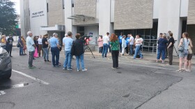 Protesters gather to support year long data center moratorium before a Tuesday quorum court meeting.