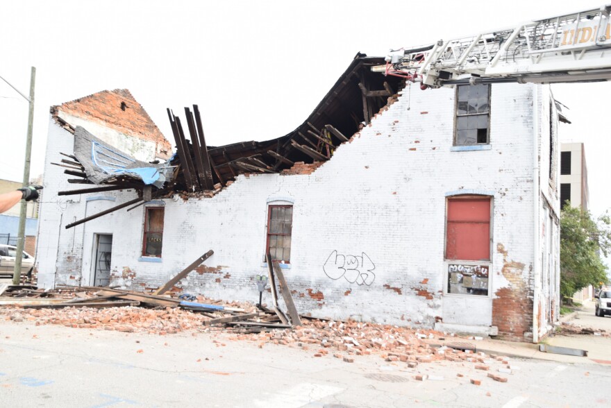 An Indianapolis firefighter was slightly injured Monday during the rescue of a man from this partially collapsed building.