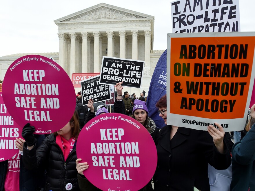 Pro-choice and pro-life activists demonstrate in front of the the US Supreme Court during the 47th annual March for Life on January 24, 2020 in Washington, DC. - Activists gathered in the nation's capital for the annual event to mark the anniversary of the Supreme Court Roe v. Wade ruling that legalized abortion in 1973. (Photo by OLIVIER DOULIERY / AFP) (Photo by OLIVIER DOULIERY/AFP via Getty Images)