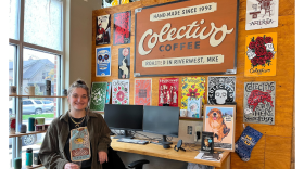 Women standing in an office in front of a Colectivo Coffee sign 