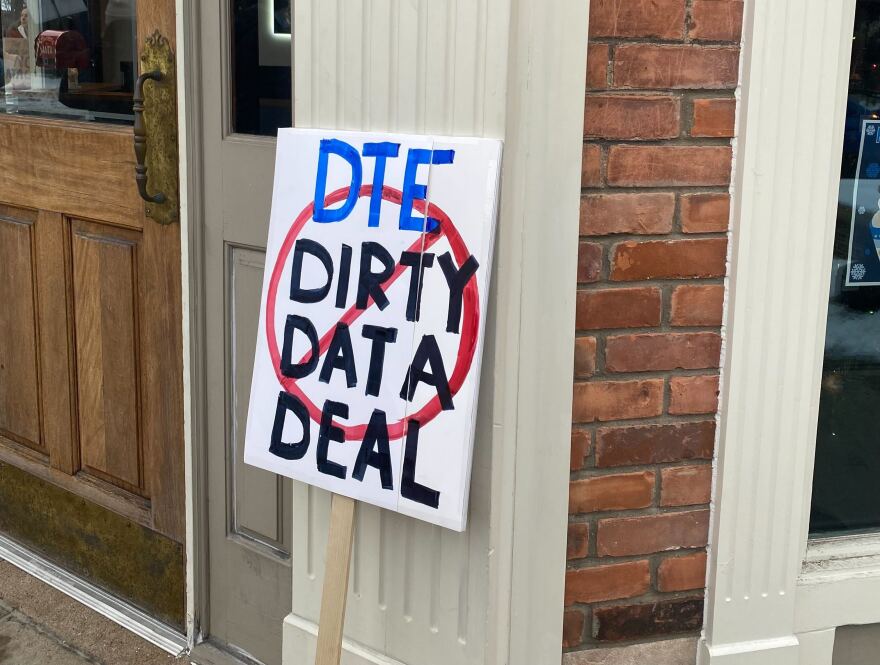 A sign reads “DTE Dirty Data Deal” with a red no-entry sign. DTE is in blue while the rest of the words are in black.
