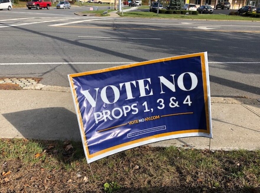 A sign urging New York voters to reject propositions 1, 3 and 4. 