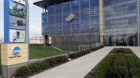 This is an April 25, 2018, file photo, showing NCAA headquarters in Indianapolis. The NCAA Board of Governors took the first step Tuesday, Oct. 29, 2019, toward allowing athletes to cash in on their fame, voting unanimously to clear the way for the amateur athletes to "benefit from the use of their name, image and likeness." The United States' largest governing body for college athletics realized that it "must embrace change to provide the best possible experience for college athletes," the board said in a news release issued after the vote at Emory University in Atlanta. (AP Photo/Darron Cummings, File)