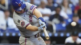 New York Mets' Pete Alonso hits a three run home run during the eighth inning of a baseball game against the Miami Marlins, Wednesday, April 2, 2025, in Miami. (AP Photo/Lynne Sladky)