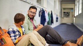 Teacher talking to student