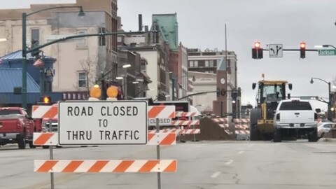 A road closed sign blocks traffic at the intersection of Main Street and Jackson Boulevard in downtown Elkhart, where construction is underway on a sewer project.