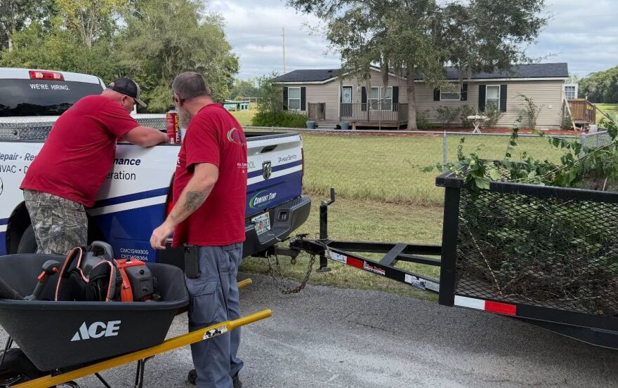 Comfort Temp Heating & Air CEO, John Waldrop, left, and Customer Service Manager, Jody Creamer, loading one of many trucks they brought with materials. (Sebasthiane Brakha/WUFT News)