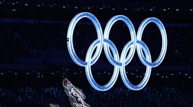 Olympic rings illuminate the opening ceremony of the 2022 Winter Olympics, Friday, Feb. 4, 2022, in Beijing. (AP Photo/Bernat Armangue)
