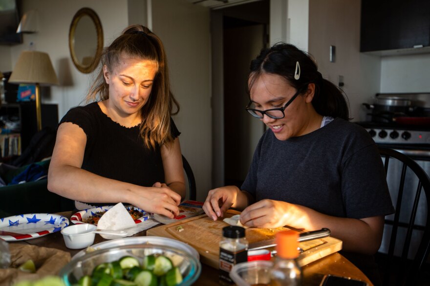 Megan Kokoris and Sonia del Casal make wontons and other dishes for that evening's dinner. Groups who stay at the observatory bring supplies and food for their week-long stay due to the remote location and treacherous route required to reach the summit.