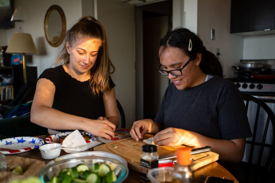 Megan Kokoris and Sonia del Casal make wontons and other dishes for that evening's dinner. Groups who stay at the observatory bring supplies and food for their week-long stay due to the remote location and treacherous route required to reach the summit.  