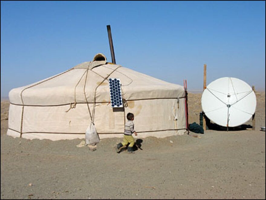 Mongolia's nomadic herders are adjusting to democracy and a market economy as well as an influx of new technology.