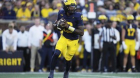 Michigan quarterback Bryce Underwood runs during the first half of an NCAA college football game against New Mexico, Saturday, Aug. 30, 2025, in Ann Arbor, Mich. (AP Photo/Ryan Sun)
