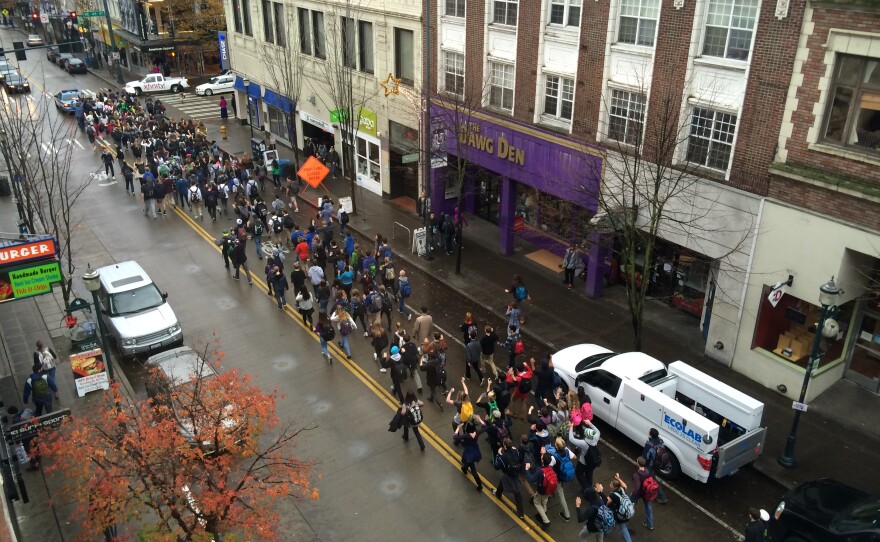 On Tuesday morning after the Michael Brown grand jury results were released, students thought to be from Roosevelt High School, walked down University Ave in Seattle chanting, "Hands up, don't shoot."