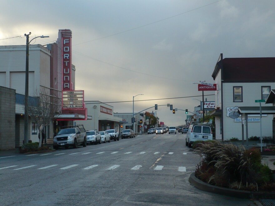Street in Fortuna, California, with cars parked along the side of the road.