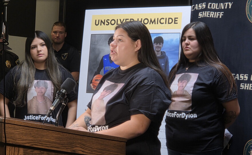 Monica Oothoudt, 27, pleads for answers about the death of her cousin, 17-year-old Dylon Oothoudt, at a press conference in Cass Lake on Oct. 7, 2026. Standing behind her are Dylon's cousin, Dalyla Oothoudt, and his sister, Rosa Oothoudt.