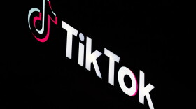 A TikTok sign is displayed on top of their building in Culver City, California. It shows a musical note followed by the words "Tik Tok."
