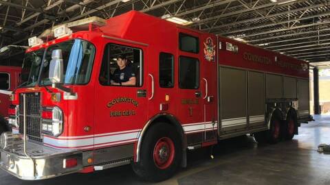 a man sits in a fire truck