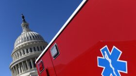 An ambulance is parked outside the US Capitol Building on Capitol Hill, in Washington as the US Senate finally took up the $1.9 trillion Covid relief package.