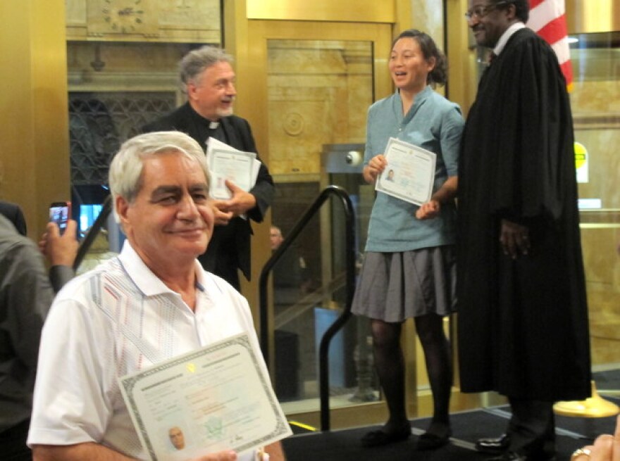 One newly-naturalized citizen beams after the ceremony (pic: Brian Bull)