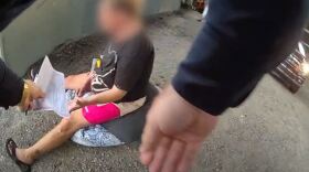 Body camera footage shows the moment an LMPD officer hands a woman in labor a citation for unlawful camping as she waits for an ambulance.