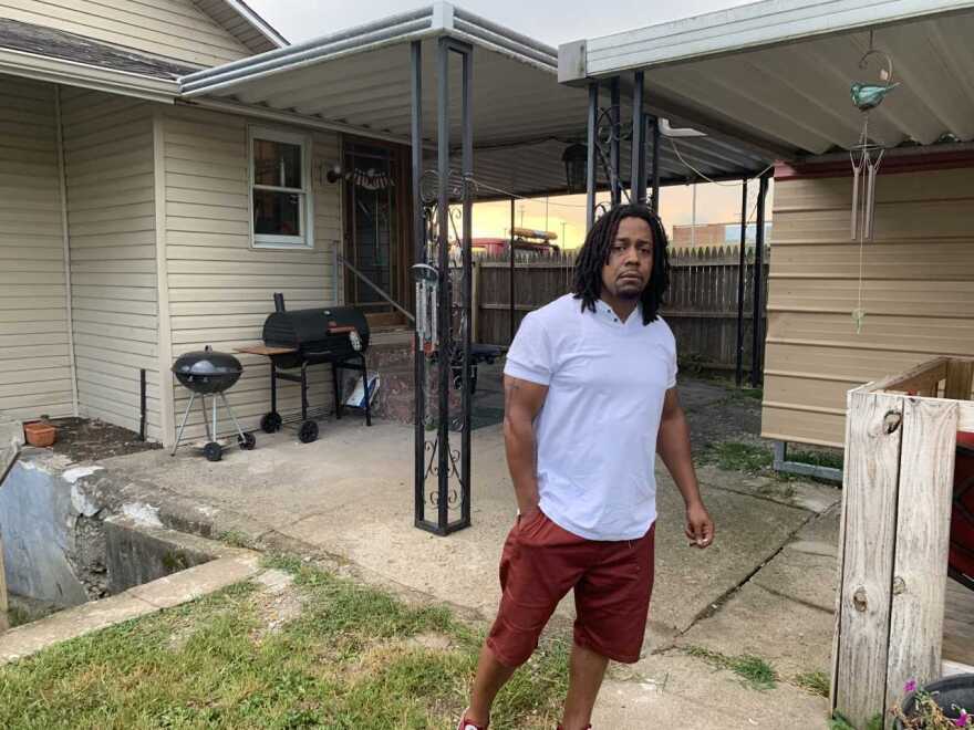 Dion Green in the backyard of his Dayton house, which has been repaired since May tornadoes badly damaged the property. Green's dad, Derrick Fudge, died in the mass shooting in the city's Oregon District last Sunday.