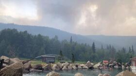 Thick smoke hangs over a hot springs resort.