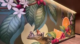 The Starbucks mural painted by Gillian Fazio includes oranges and an alligator. “Looking back, every move I made has helped guide me to where I am now doing what I love for a living,” Fazio said. (Dianne Radic/WUFT News)