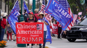 FILE - Chinese Americans supporters of former President Donald Trump stand outside the hotel where the 2023 Fall California Republican Convention is being held in Anaheim, Calif., Sept. 29, 2023. (AP Photo/Damian Dovarganes, File)