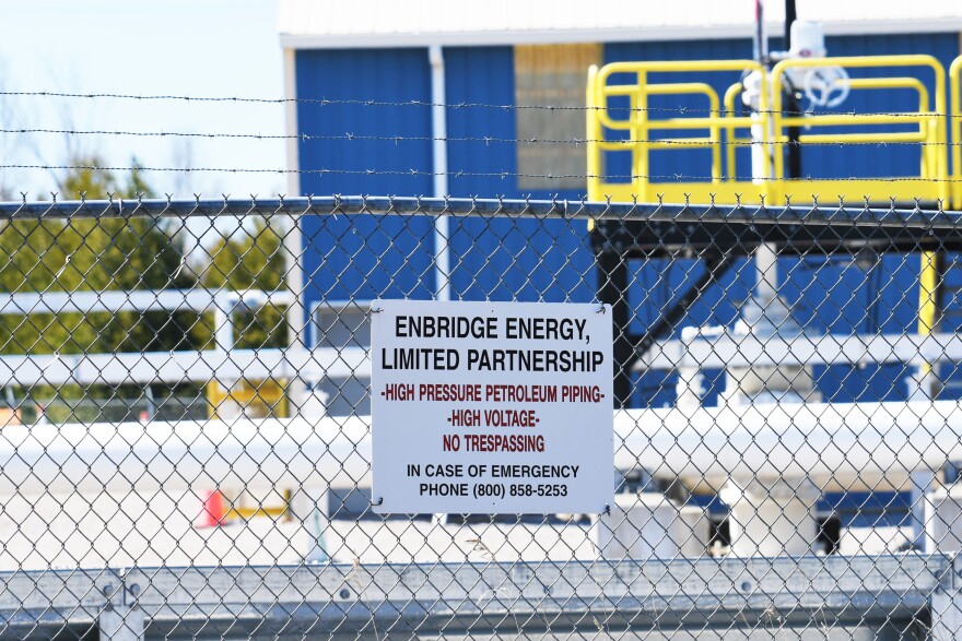  A warning sign attached to a chain link fence at an Enbridge Energy pumping station on the south shore of the Mackinac Straits.