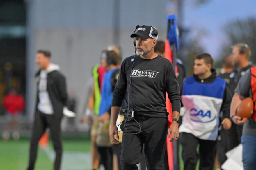 Coach Chris Merritt of Bryant University has three of his high school players on the Seattle Seahawks and one in the Patriots front office.