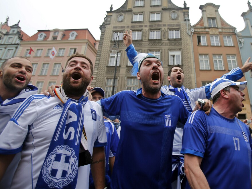Greek fans shout slogans before Friday's soccer match between Greece and Germany in Gdansk, Poland.