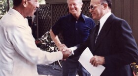 This file photo shows former Egyptian President Anwar al-Sadat (L) as he shakes hands with former Israeli Premier Menachem Begin, as former U.S. President Jimmy Carter looks on 06 September 1978 at Camp David. The meetings led to a treaty between Israel and Egypt.